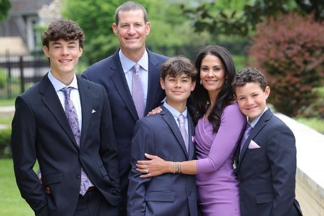 Photo of Tracy Wolfson and  David Reichel along with their three sons.